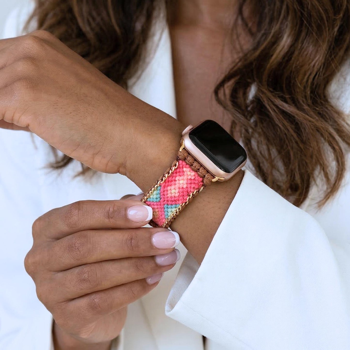 Coral pink woven Apple Watch band with teal detail, boho smartwatch strap, adjustable waxed cord bracelet in gold tone