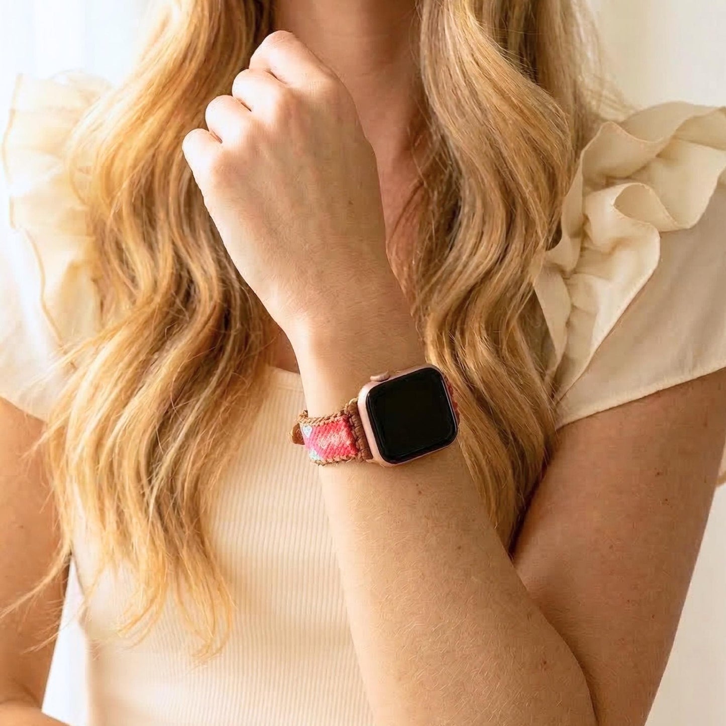 Coral pink woven Apple Watch band with teal detail, boho smartwatch strap, adjustable waxed cord bracelet in gold tone