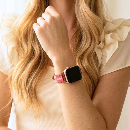 Coral pink woven Apple Watch band with teal detail, boho smartwatch strap, adjustable waxed cord bracelet in gold tone