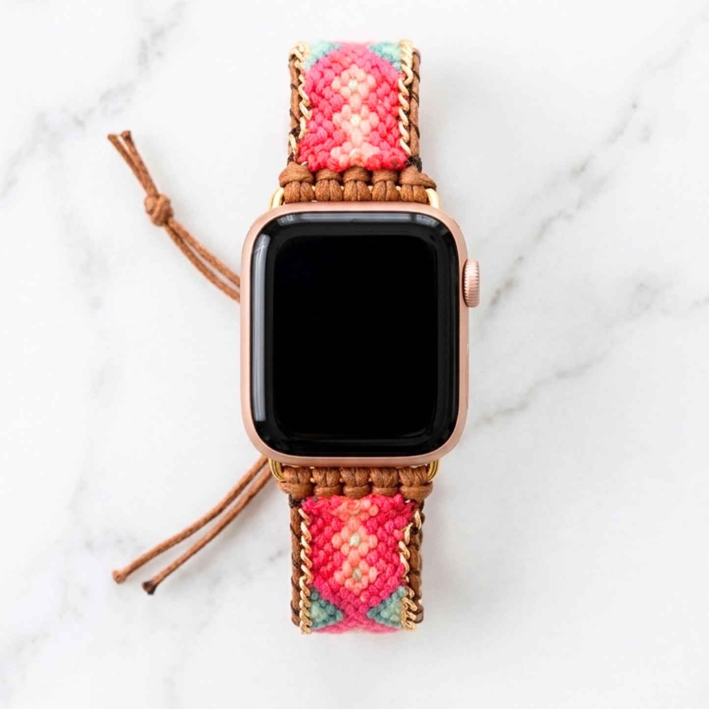 Coral pink woven Apple Watch band with teal detail, boho smartwatch strap, adjustable waxed cord bracelet in gold tone