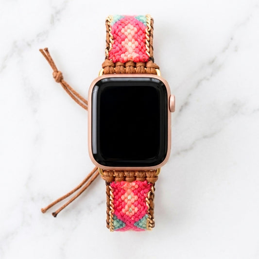 Coral pink woven Apple Watch band with teal detail, boho smartwatch strap, adjustable waxed cord bracelet in gold tone